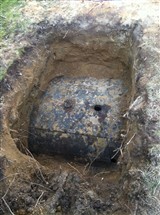 Step 1:
Dig down and expose top of oil tank.